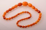 beads, amber, 61.01 g., largest stone size 2.9 x 2.3 x 2.3 cm, total length 65 cm...