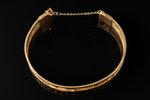 a bracelet, gold, filigree, 750 standard, 32.30 g., the diameter of the bracelet 6.6 x 5.5 cm...