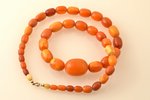 beads, amber, 57.27 g., the item's length 65 cm, largest stone size 2.9 x Ø2.15 cm...