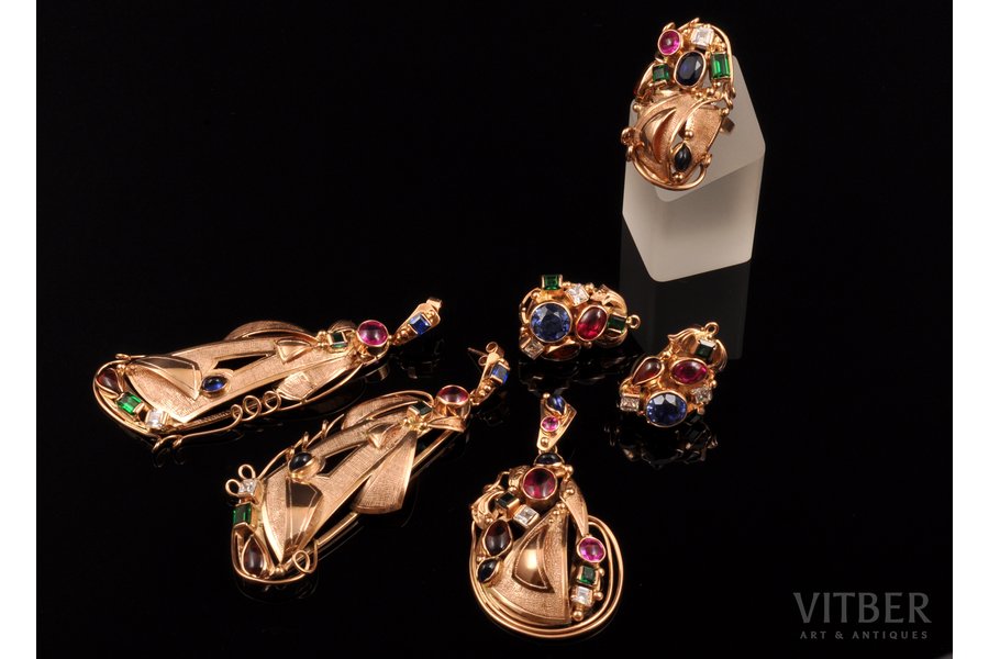 a set: a ring, 2 pairs earrings, a pendant, designed by Olegs Auzers, gold, decorative stones, 585 standart, (total) 94.20 g., the item's dimensions (earrings) 8.1 x 3.1 cm, 2.8 x 1.9 cm; (pendant) 6.4 x 3.3 cm, the size of the ring 18, the 90ies of 20th cent., Rīga, Latvia