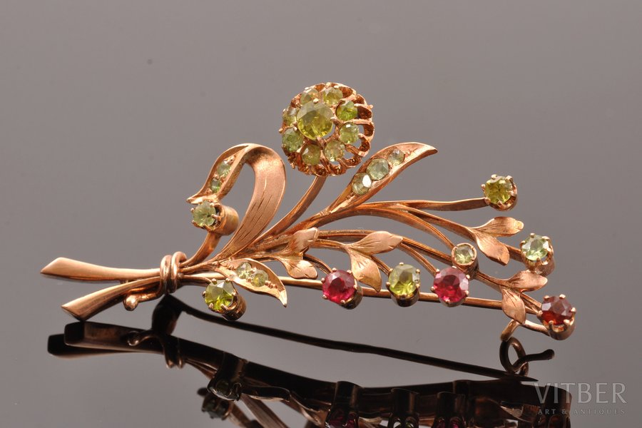 a brooch, gold, 56 standard, 7.20 g., the item's dimensions 5.4 x 2.2 cm, chrysolite, the beginning of the 20th cent., Moscow, Russia