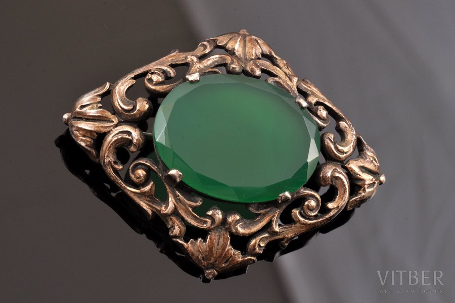 a brooch, silver, 800 standard, 14.25 g., the item's dimensions 5 x 3.9 cm, jadeite, the beginning of the 20th cent., Europe