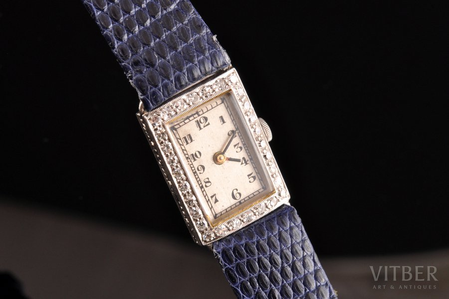 ladie's wristwatch, in a case, "IWC", Switzerland, diamonds, platinum, (dial) 1.9 x 1.4 cm, (strap) 20 cm, "Seiko Quartz" Movement Mechanism
