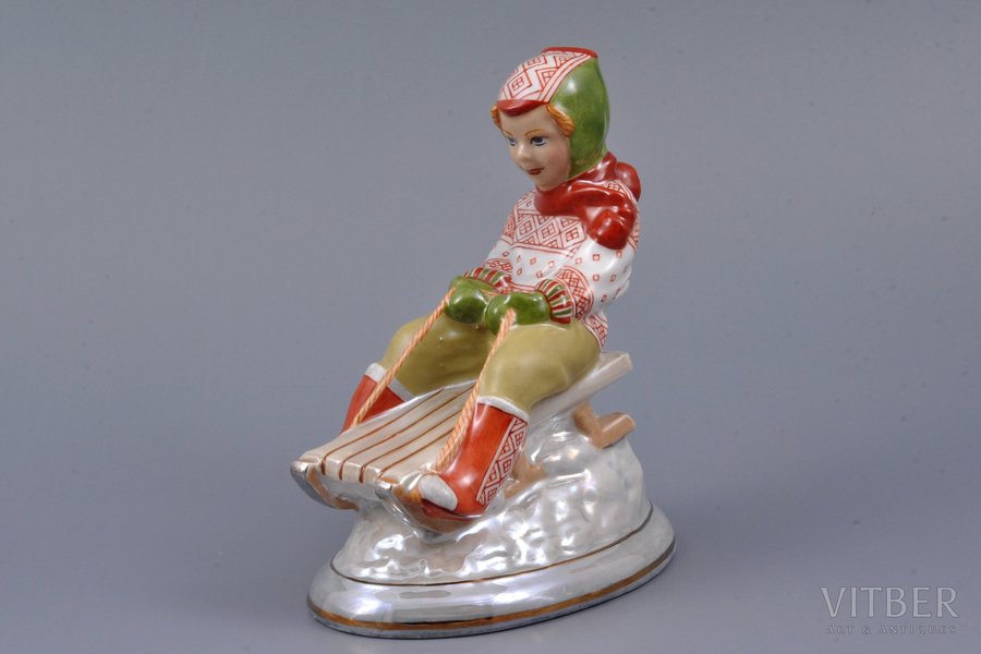 figurine, Girl on a sleigh, porcelain, Riga (Latvia), sculpture's work, handpainted by Iveta Aigare, molder - Zina Ulste, beginning of 21st cent., h 12.2 cm