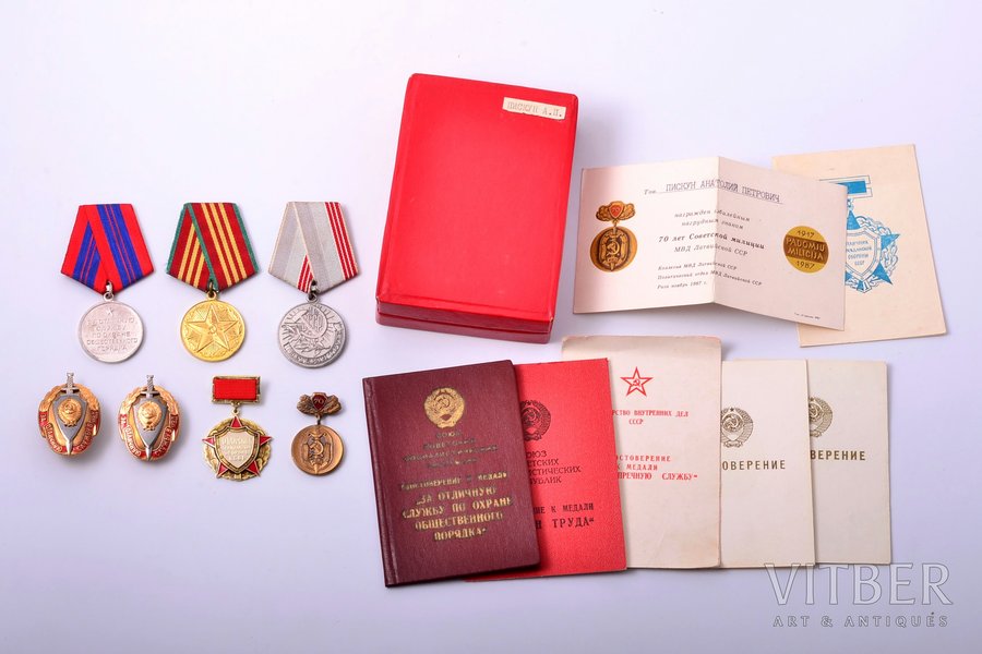 set of awards with documents, (7 awards), awarded to Piskun Anatoly Petrovich, medal "Medal for Distinguished Service in Defence of Public Order" (1977), medal "For 10 years of excellent service " (1976), badge "Excellent worker in the Civil Defense of the USSR" (1977), 2 badges "For excellent service in ministry of internal affairs" (1982 и 1986), medal "Veteran of Labour" (1984), badge "70 Years of the Soviet Militia, Ministry of internal affairs of Latvian SSR" (1987), USSR, 70-80ies of 20th cent.