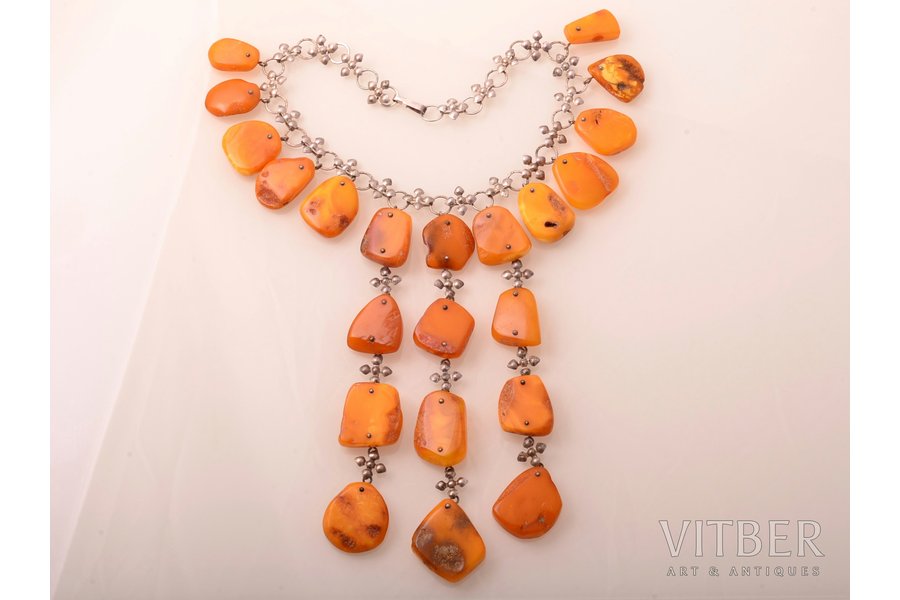 a necklace, amber, largest amber stone size 3.6 x 3.1 cm, smallest amber stone size 2.4 x 1.6 cm, metal, 100 g., the item's dimensions 38.5 cm