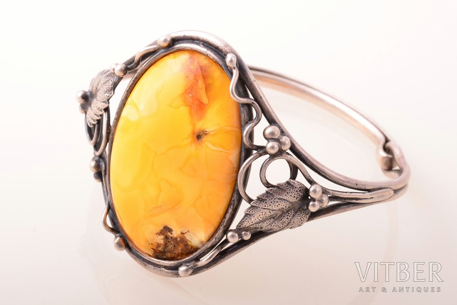 a bracelet, silver, 925 standard, 26.50 g., the diameter of the bracelet 5.8 - 4.8 cm, amber, amber stone size 3.7 x 2.4 cm, with chip