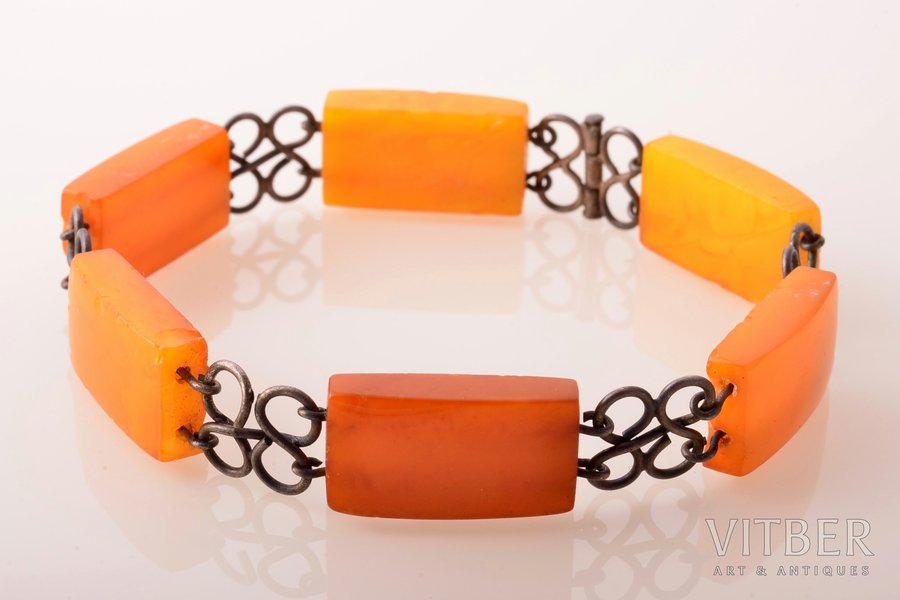 a bracelet, amber stone size 2.2 x 1.2 x 0.6 cm, metal, 13.50 g., the item's dimensions 21.5 cm, amber, chips