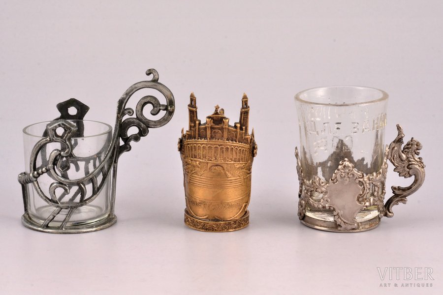 set, 3 miniature tea glass-holders, 2 glass-holders with glasses, metal, the beginning of the 20th cent., Ø (inside) 3.6 / 3.2 / 2.3 cm, h 6.1/ 3.9 / 5.4 cm