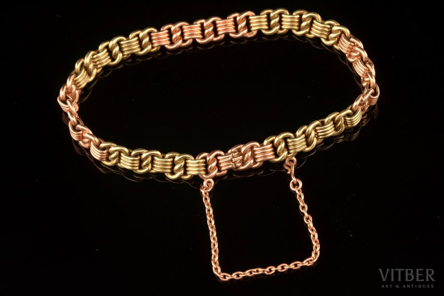 a bracelet, bicolor gold, 56 standard, 24.55 g., the item's dimensions 20.1 cm, the diameter of the bracelet 6.4 cm, 1908-1917, St. Petersburg