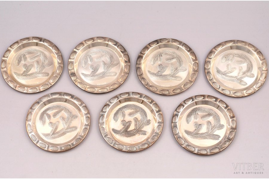 a set of 7 saucers, silver, 83...