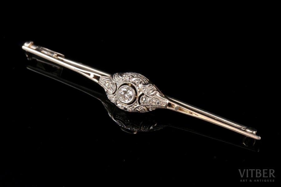 a brooch, white gold, 585 standard, 2.40 g., the item's dimensions 5.8 х 0.8 cm, diamonds, central gemstone ~ 0.14 ct