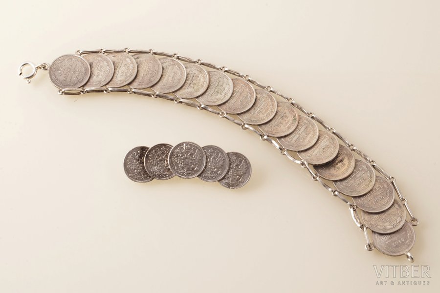 комплект, часовая цепь из монет 10 копеек (1889-1915), брошь из монет 5 копеек, биллон серебра (500), рубеж 19-го и 20-го веков, Российская империя, вес часовой цепи 35.35 г, длина 20 см, застежка 925 проба; вес броши 4.96 г, размер 5.1 x 1.7 см