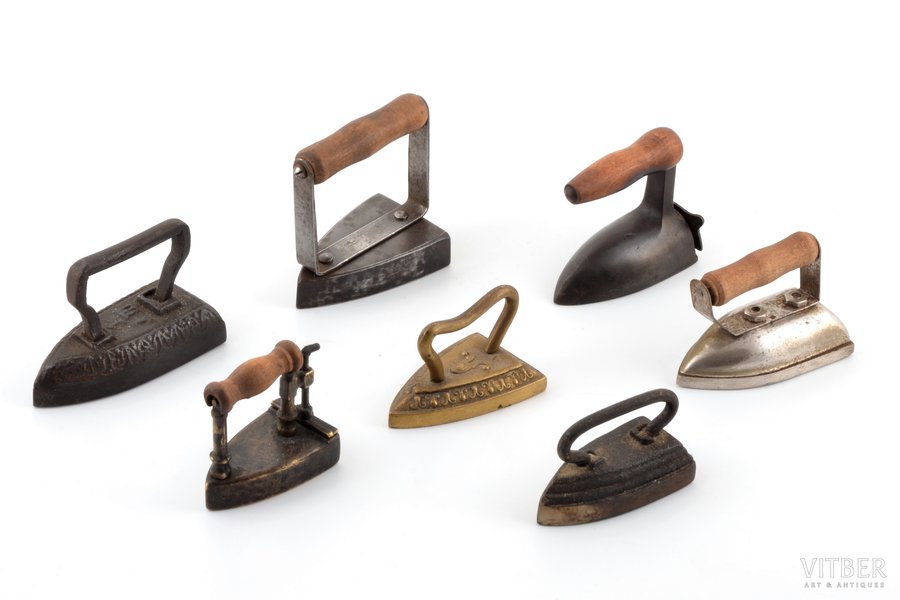 set of 7 irons (miniature size), metal