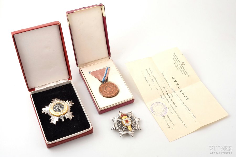 set of awards with certificate, Order of the Yugoslav People's Army (III class, in a case), Medal for War Merit (in a case) and Order of Military Merit (III class, silver, 900 standard), Yugoslavia, the 2nd half of the 20th cent., 67 x 70 / 46 x 39 / 66 x 66 mm