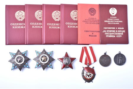 set of awards and documents, awarded to Pavlenko Gennady Nikolaevich: order For Service to the Motherland in USSR armed forces, Nº 1217, 2nd class (1989); order For Service to the Motherland in USSR armed forces, Nº 60010, 3rd class (1988); Order of the Red Star № 3789157 (1987, micro chip on the surface of beam 7 o'clock); Order of the Red Banner Nº 478167 (1984); medal For Military Merit (1981); medal, For Distinction in Guarding the State Border of the USSR (1979), USSR, 1979-1989, awards of one of the outstanding and most effective helicopter pilots of the Afghan war. 10 years of continuous participation in combat operations. Over 1000 combat missions. The winner of the lot will receive a set of copies of record-cards.