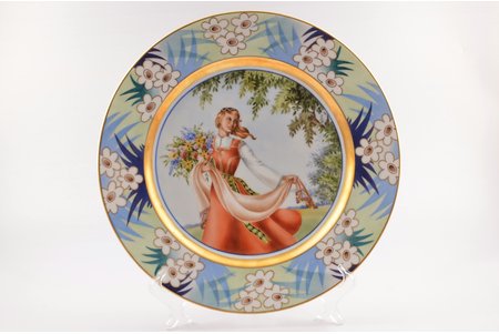 decorative plate, "Young woman in traditional costume with flowers", porcelain, M.S. Kuznetsov manufactory, signed painter's work, handpainted by Natalia Kuznetsova, sketch by Nadezda Boiko, Riga (Latvia), 1937, Ø 32.5 cm, the presented lot was made in a single copy, as evidenced by the signature of the technical director of the factory Alexey Turkov (AT) with the label "1" (meaning of the mark: a work in a single copy, in the submitted form and in a highly artistic painting according to a sketch).