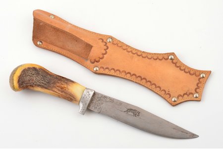 hunting knife, with engraved boar, metal, bone, total length 29 cm, blade length 16.6 cm, in leather sheath