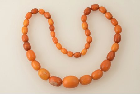 beads, amber, 49.70 g., the item's length 59 cm, largest stone size 2.6 x Ø2.05 cm