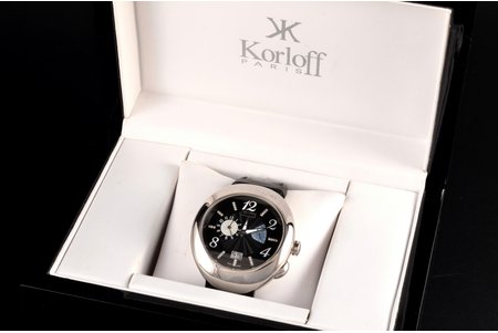 wristwatch, Korloff men's quartz watch, ref. FDT46, no. 239, from 08-2007, steel, diamonds, domed sapphire crystal, black leather strap with covered butterfly folding clasp, France, beginning of 21st cent., 4.6 x 5.3 x 1.2 cm, mechanism in working order, with original case and box