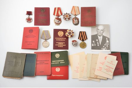 set of awards and documents, awarded to Shultz Yan Andreevich (Шульц Ян Андреевич); medal XX Years of the Red Army with certificate (1938) № 9194; Order of the Red Banner № 179934, Order of the Patriotic War, 2nd class, № 548385, order "Badge of Honour" № 140643 with certificate (1946); medal For Military Merit (1967); Order of the Patriotic War, 1st class (jubilee), № 546987 with certificate, medal For the Victory over Germany; badge of 50 year Anniversary of Latvian Riflemen; photo of the awardee and documents, USSR, the 2nd half of the 20th cent.