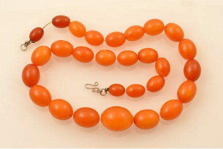 beads, amber, 57.70 g., item's length ~53 cm, largest stone size 2.6 x Ø2 cm, in some places chips on the surface